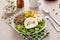 Breakfast bowl with quinoa, herbed corn, feta cheese and fried egg