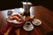 Breakfast in Brazil with basket buns, coffee cup and cookies.