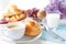 Breakfast, brunch, coffee with homemade pastries on white background with flowers