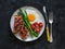 Breakfast, brunch plate - fried egg, asparagus, salmon sandwich on a dark background, top view