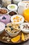 Breakfast buffet with cereals, yoghurt and fruit on wooden tray