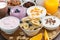 Breakfast buffet with cereals, yoghurt and fruit on wooden tray