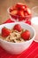 Breakfast cereal, milk and strawberries