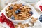 Breakfast with cereals flakes, nuts and berries, closeup