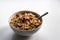 Breakfast cereals with healthy cornflakes and delicious walnuts and honey in a bowl are the perfect start in the day