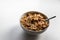 Breakfast cereals with healthy cornflakes and delicious walnuts and honey in a bowl are the perfect start in the day