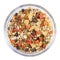 Breakfast cereals, oatmeal with candied fruits and nuts in a glass bowl, white background