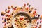 Breakfast cereals rings in a white bowl. Oatmeal, corn flakes on a pink background. Breakfast or brunch buffet in a hotel or