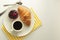 Breakfast, coffee and croissants with berry jam on white table. French croissant. Fresh buns meal, snack. Isoalted with copy space