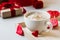 Breakfast coffee love heart red rose setting with white mug and gift box in Valentine`s day setting