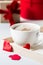 Breakfast coffee love heart red rose setting with white mug and gift box in Valentine`s day setting