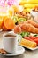 Breakfast with coffee, orange juice, croissant, egg, vegetables