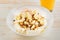 Breakfast concept. Yogurt with flakes, fruits and juice on white wooden background