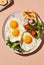 Breakfast containing fried eggs, salat, pancakes, and coffee. Image generated by AI.