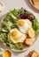 Breakfast containing fried eggs, salat, pancakes, and coffee. Image generated by AI.