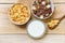 Breakfast Cornflakes and various cereals in bowl and milk cup on wooden background for cereal healthy food