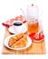 Breakfast with croissant, honey and coffee on wooden board