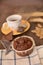 Breakfast cup coffe espresso black cereals muffin milk chocolate pieces on table morning food