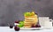 Breakfast with a cup of coffee and a stack of classic american pancakes served with black cherry, apricot, kiwi and mint. Blue