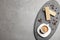 Breakfast with delicious wafers and coffee on grey table. Space for text