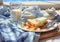 Breakfast with flakes, milk, coffee, toast, cheese and butter on a table with tablecloth with blue and white squares.