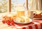 Breakfast with flakes, milk, coffee, toast, cheese and butter on a table with tablecloth with red and white squares