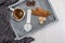 Breakfast. Flat lay. Wristwatch , cup of coffee, anise stars, cinnamon sticks on a tray.Top view. Creative food concept. Template