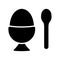 Breakfast food icon. Soft boiled egg in eggshell in egg holder