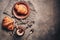 Breakfast fresh croissants and hot coffee with froth on a dark rustic background. Top view, flat lay,copy space