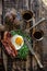 Breakfast with fried egg and becon in rustic stile