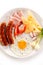Breakfast - fried egg and sausages, cheese, ham and vegetables