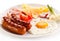 Breakfast - fried egg and sausages, cheese, ham and vegetables