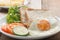 Breakfast fried egg with whole wheat breads on white plate.