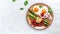 Breakfast. fried eggs with green asparagus, bacon, ham and and cherry tomatoes. Ketogenic, keto food. Long banner format, top view