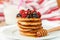 Breakfast. Fritters with honey and berries - raspberries and blueberries