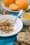 Breakfast, fruit, corn flakes, milk and orange juice on the wooden table