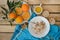 Breakfast, fruit, corn flakes, milk and orange juice on the wooden table