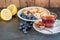 Breakfast with fruits on the dark rustic background.