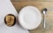 Breakfast: Healthy food oats cookies in wood bowl and white plate on wood background. oatmeal cookies food breakfast. Top view