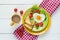 Breakfast with heart-shaped fried egg, toast, cherry tomato, let