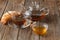 Breakfast with herbal tea and croissant on wooden vintage table