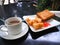 Breakfast with hot cocoa; deep-fried dough stick or Patongko with Sweetened condensed milk and toast with strawberry jam