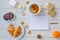 Breakfast from hot croissants, butter,tea and currants on wooden table. Flat lay