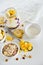 Breakfast in a jar: cornflakes, banana, fresh berries, granola, yogurt on a light background. The concept of healthy eating, high-