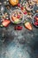 Breakfast in jars. Muesli with strawberries and other fresh berries, nuts and seeds on rustic background