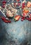 Breakfast in jars. Oatmeal with strawberries and other fresh berries, nuts and seeds on rustic background, top view