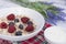 Breakfast meal of a bowl of muesli with yogurt and dried lavender