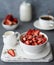 Breakfast with muesli, strawberries and milk