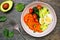 Breakfast nutrient bowl top down view table scene on slate