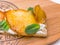 Breakfast open sandwich with honey pear, soft cream cheese ricotta, mint on a rustic wooden board. Crispbread Crostini appetizers